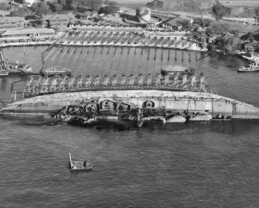 USS Oklahoma in 90 degrees position during the 'parbuckling' process.